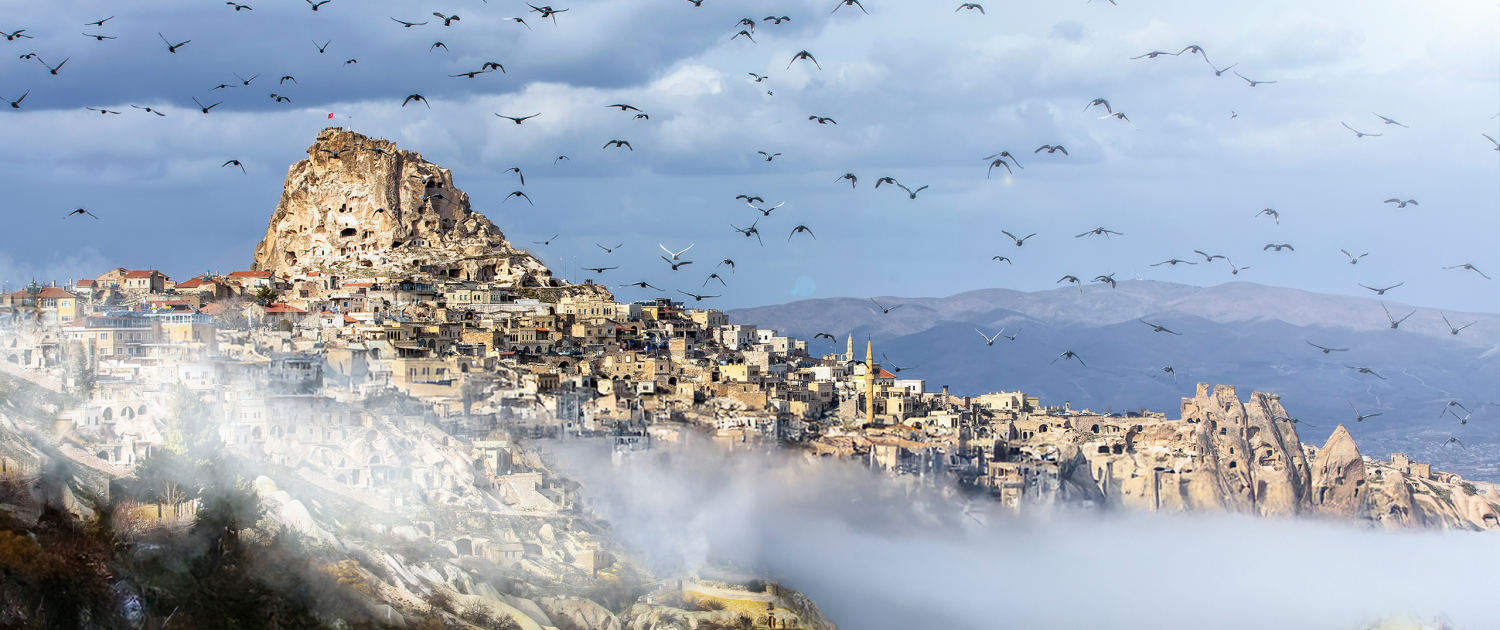 Uchisar Castle and Pigeon Valley Cappadocia Landscape Uchisar Castle Pigeon Valley Cappadocia landscape with birds
